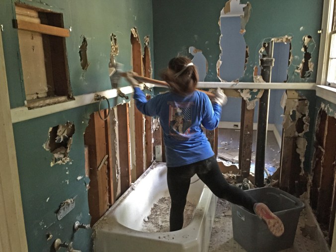 Real women swing sledgehammers (while kicking their leg up in an awkward demo dance move).