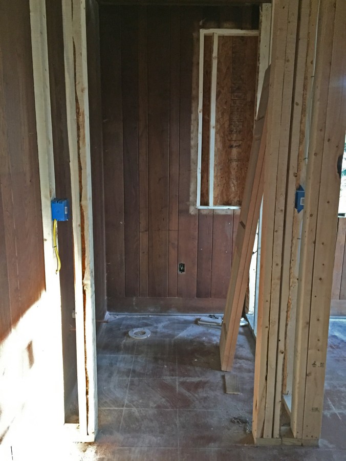 Our itsy-bitsy powder room! (You can see the toilet rough-in on the floor in the far left corner.)