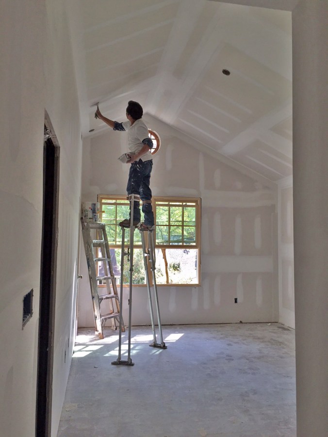 Super stilts to put the finishing touches on the master bedroom!