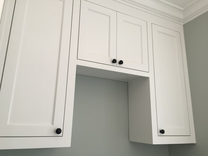 Cabinets over the Washer/Dryer.