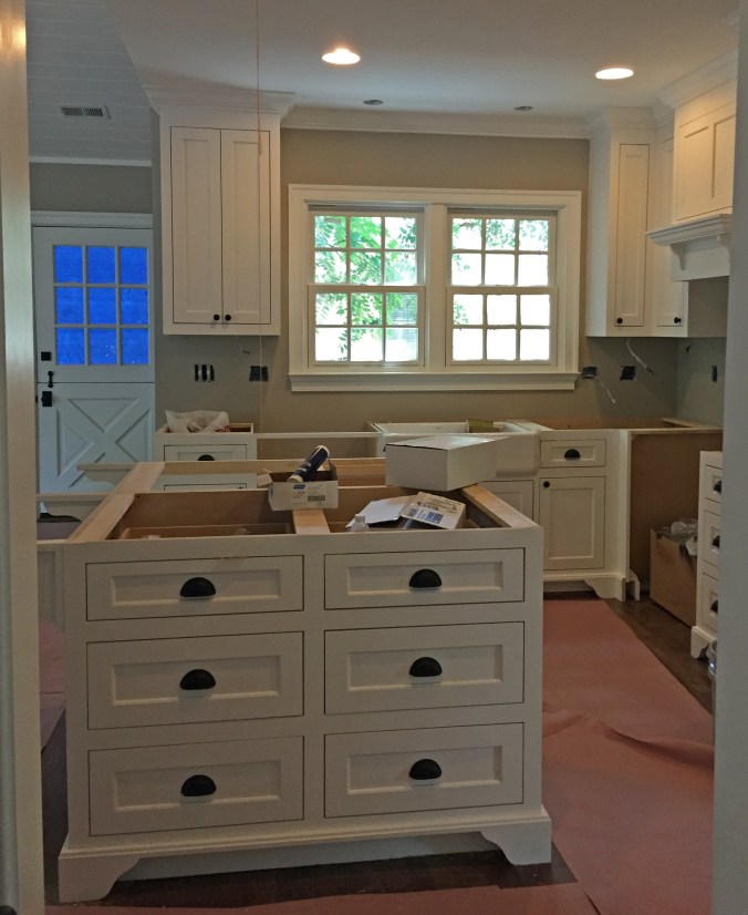 Trim painted and hardware on. It's starting to look pretty good around here :)