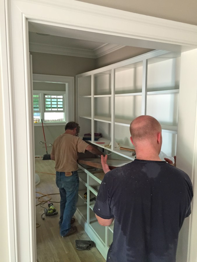 Wrangling it into place.